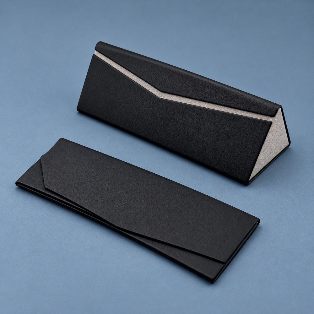 Black folding glasses case shown assembled and collapsed flat