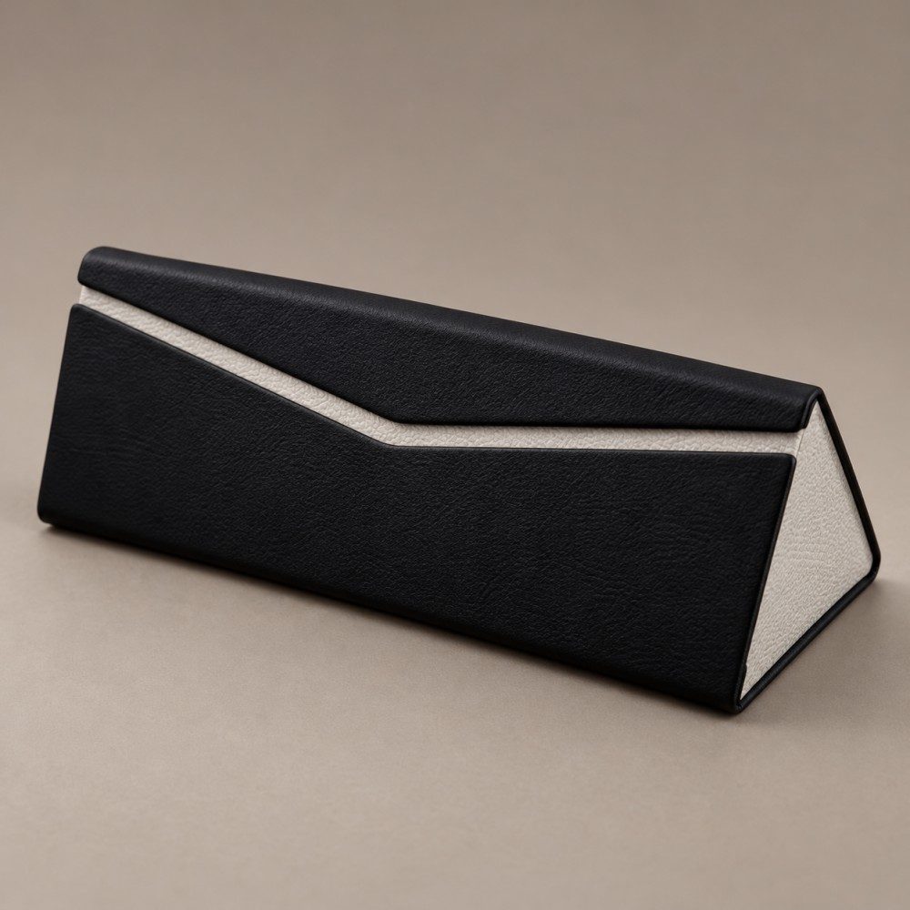 Black handmade glasses case with a light gray contrast band and triangular side panel
