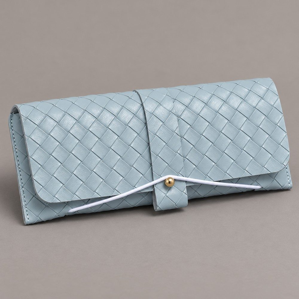 Light blue soft eyewear case with basket-weave texture, a central fastening tab and white cord around a gold-tone stud.