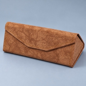 Coffee brown PU leather folding glasses case with distressed-look texture, ochre stitching and an envelope-style flap.