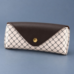 White cross-lattice PVC faux leather sunglasses case with a brown envelope flap and gold-tone hexagonal snap cap.