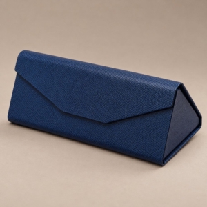 Navy triangular folding glasses case with a crosshatch exterior and concealed magnetic flap