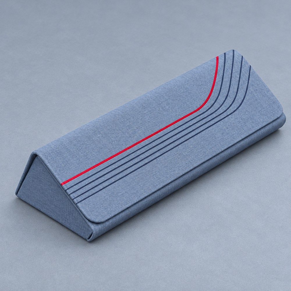 Blue custom magnetic glasses case with a triangular profile, textured finish and curved red and navy stripes.