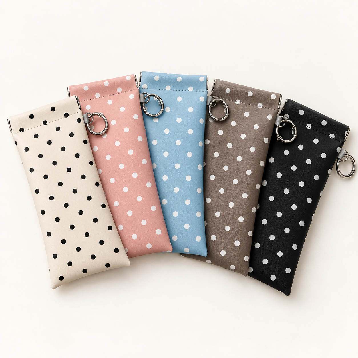 Polka dot eyeglass pouches in ivory, pink, blue, taupe and black