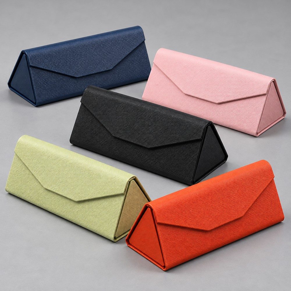 Navy, light pink, black, pale lime and orange triangular glasses cases displayed in their expanded form