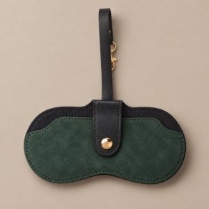 Custom sunglasses pouch in dark green with a black hanging strap and gold-tone button