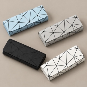 EC-145 geometric glasses cases in light blue, gray, black and white arranged on a taupe background.
