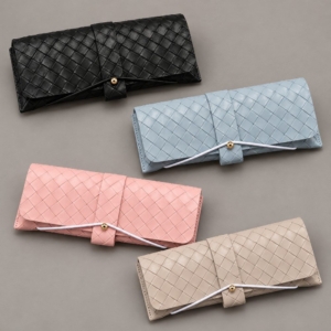Basket-weave textured eyewear cases in black, light blue, pink and milk-tea beige with cord-and-stud closures.