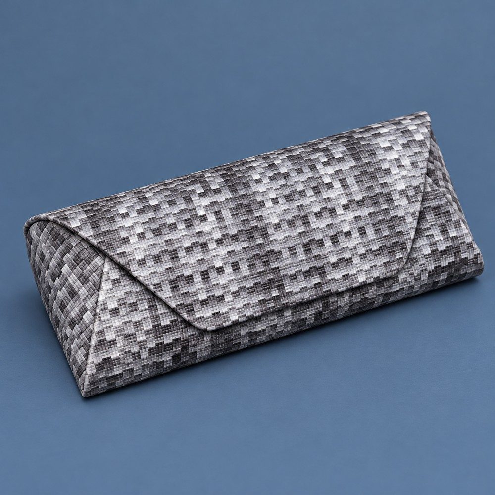 Gray mosaic-pattern glasses case with an envelope-style flap and curved sides on a slate blue background.