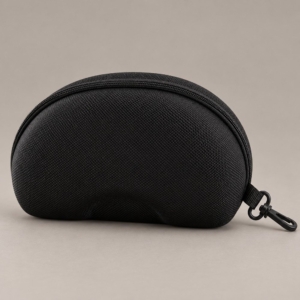 Large black EVA sunglasses case with a textured exterior, perimeter zipper and side swivel clip on a taupe background.