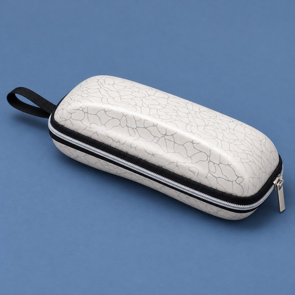 White crackle-pattern PU and EVA sunglasses case with a zipper and black webbing loop on a blue background