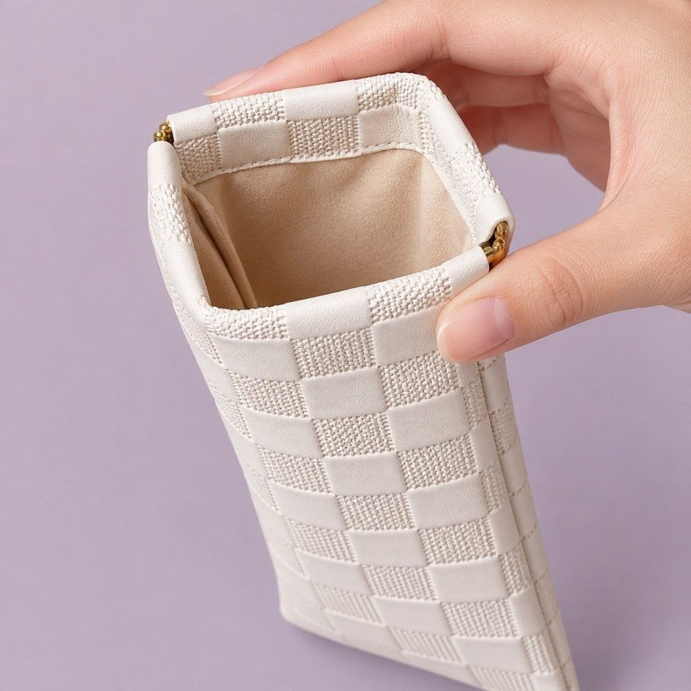 Squeeze-top sunglasses pouch opened to show its soft fabric lining