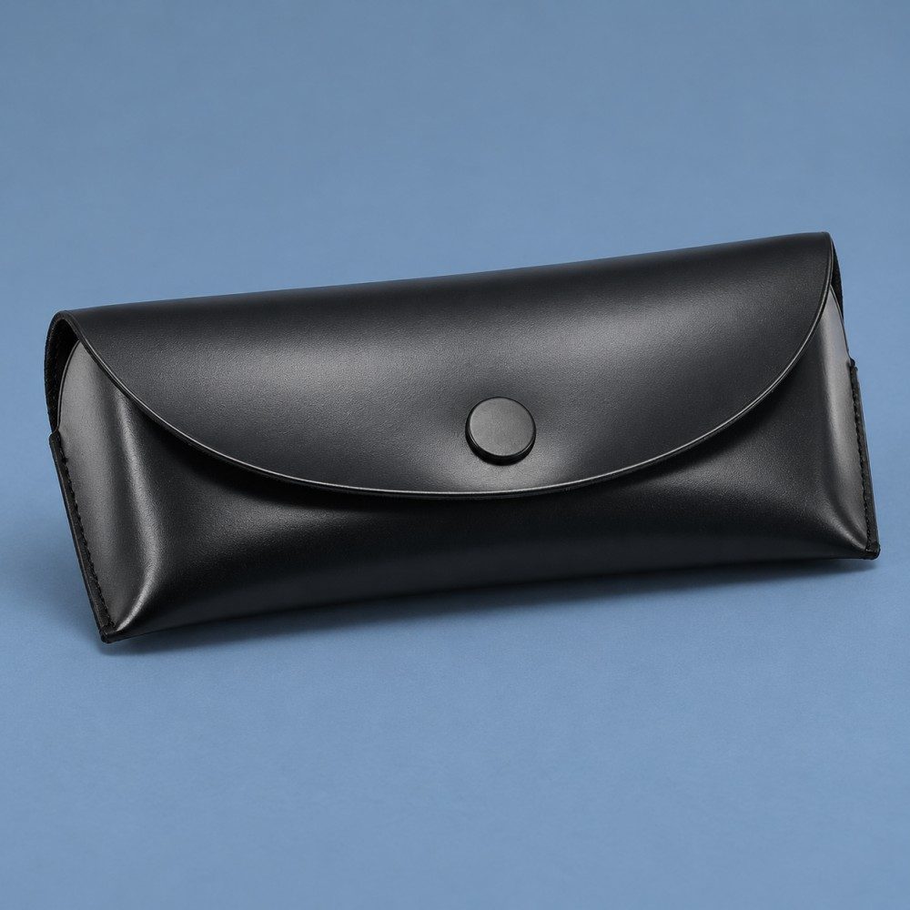 Black soft eyeglass case with optional presentation box, drawstring pouch, cleaning cloth and screwdriver keychain.