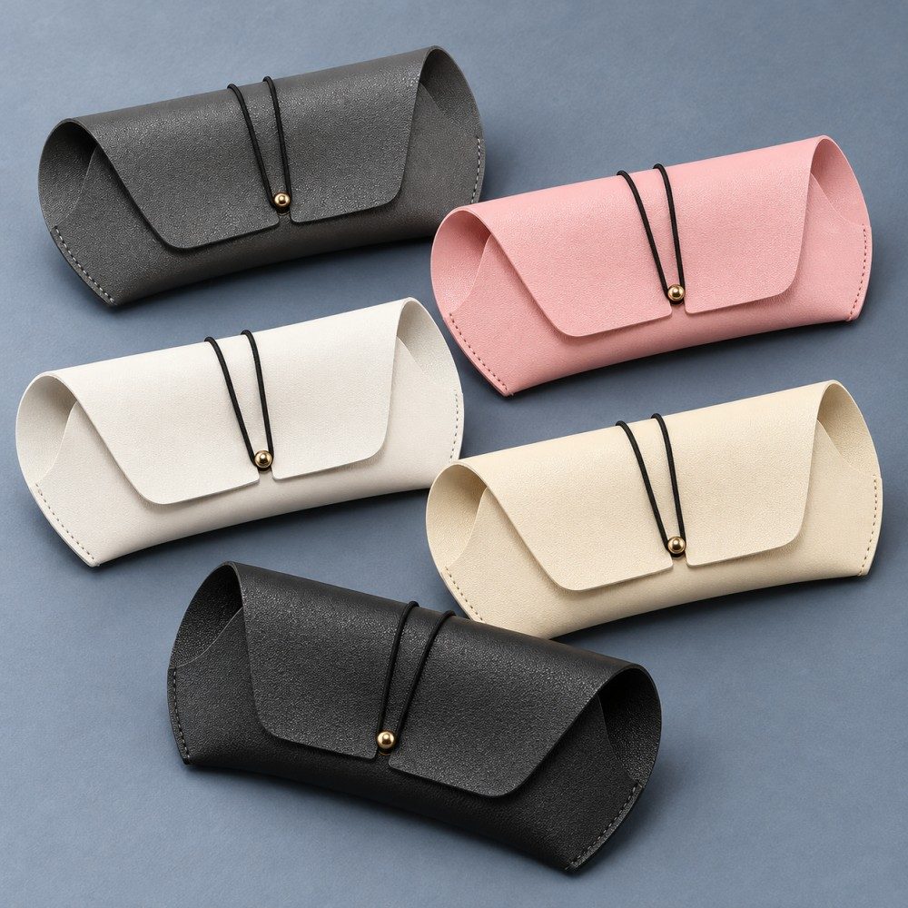Five soft sunglasses cases in gray, pink, white, cream yellow and black with matching cord-and-stud closures.