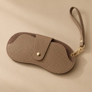 Taupe brown PU glasses pouch with strap and central snap-button closure