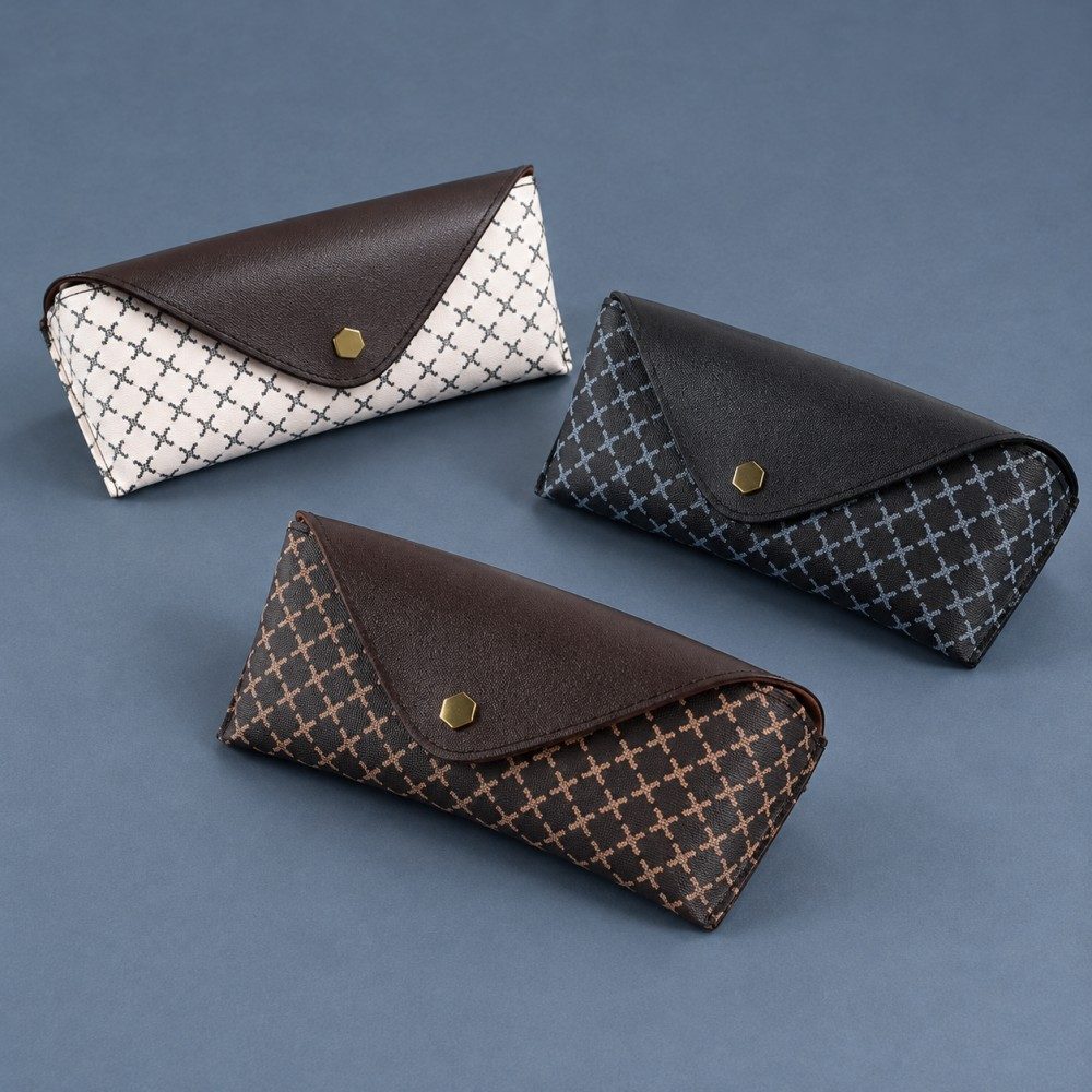 Three cross-lattice sunglasses cases in white, black and coffee brown with matching envelope flaps and snap closures.