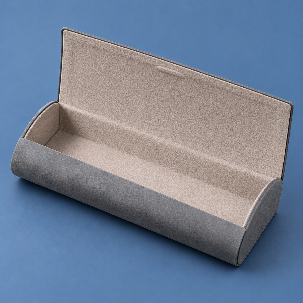 Open gray JH eyeglass case showing the light gray flocked interior, lined flap and curved front wall.